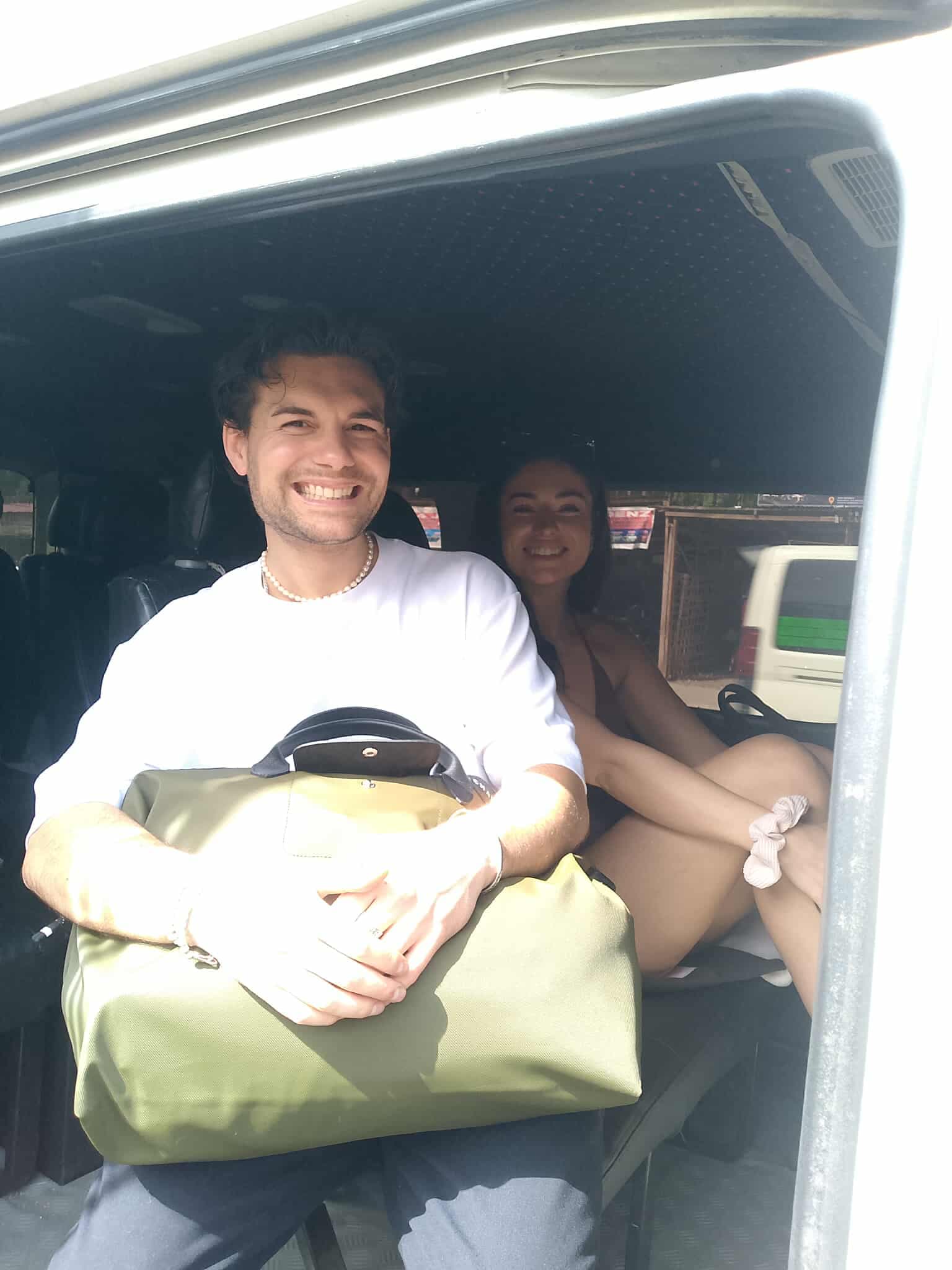 Happy passengers in a private van in Siargao
